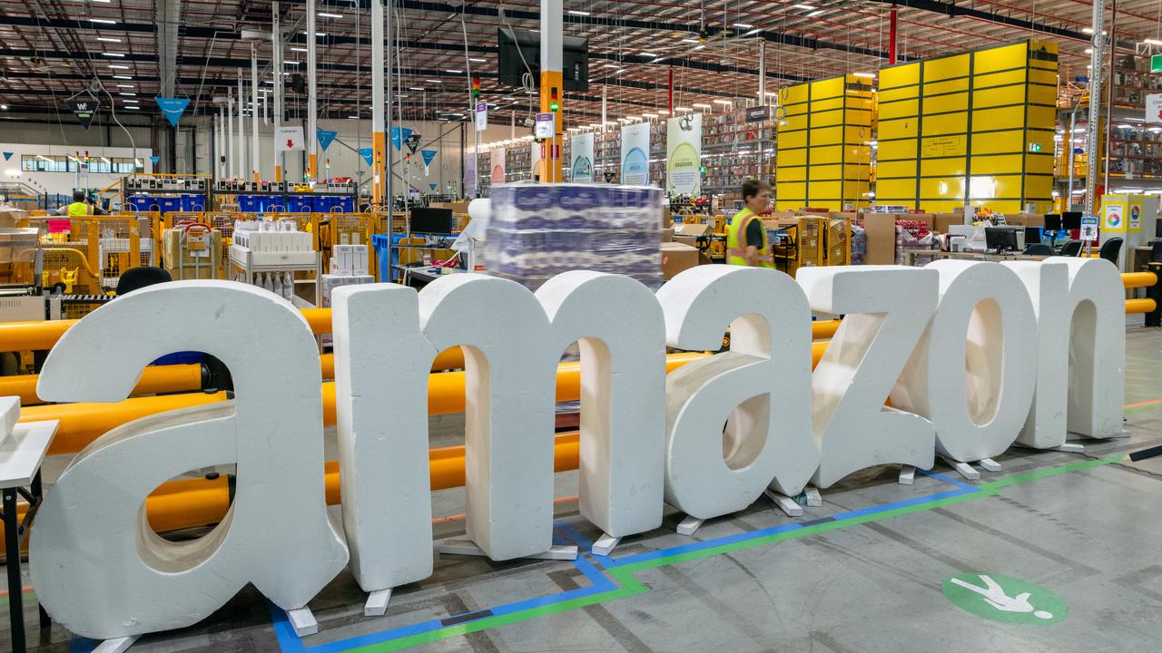 A workers move goods at an Amazon warehouse (file image)