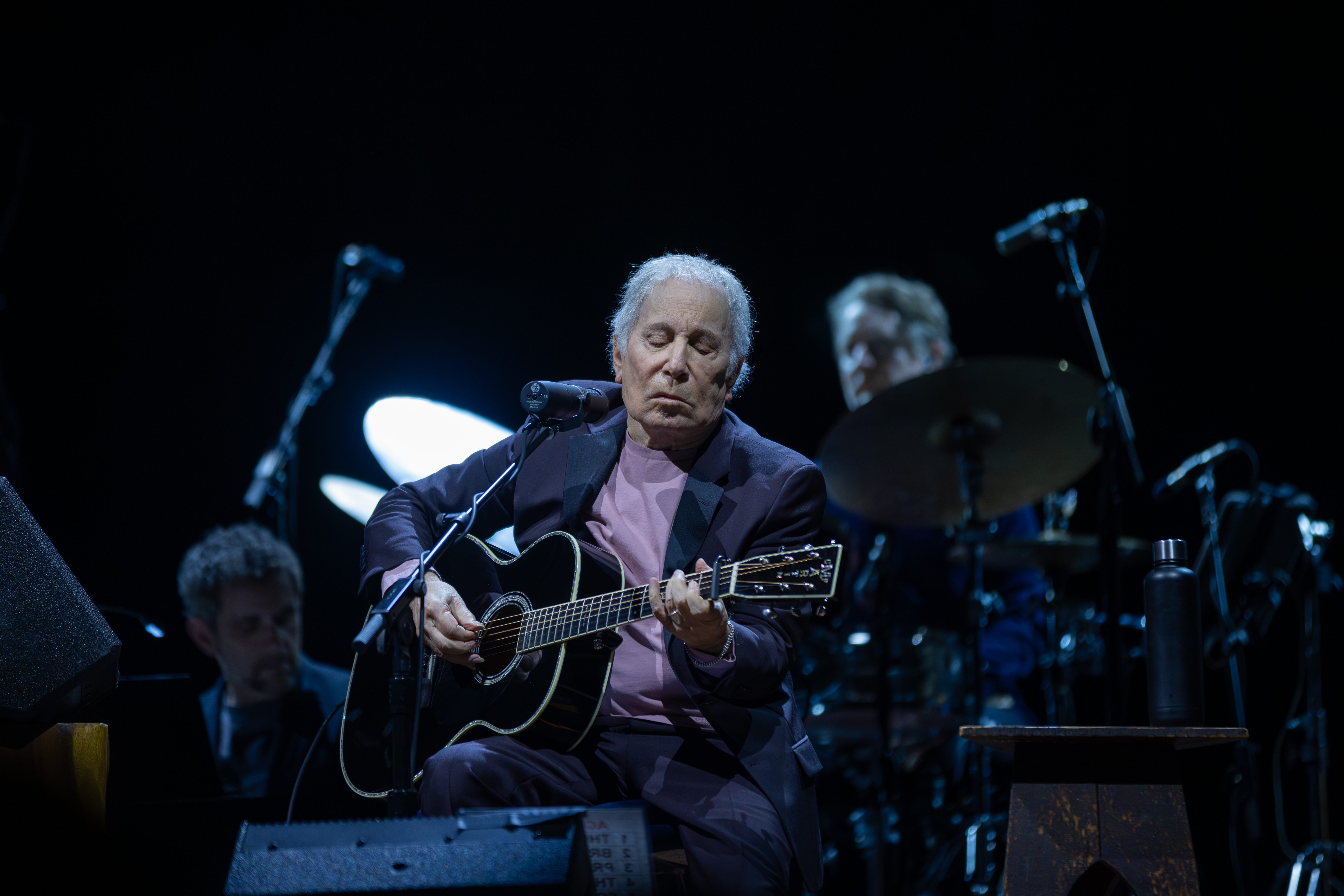 older singer playing guitar