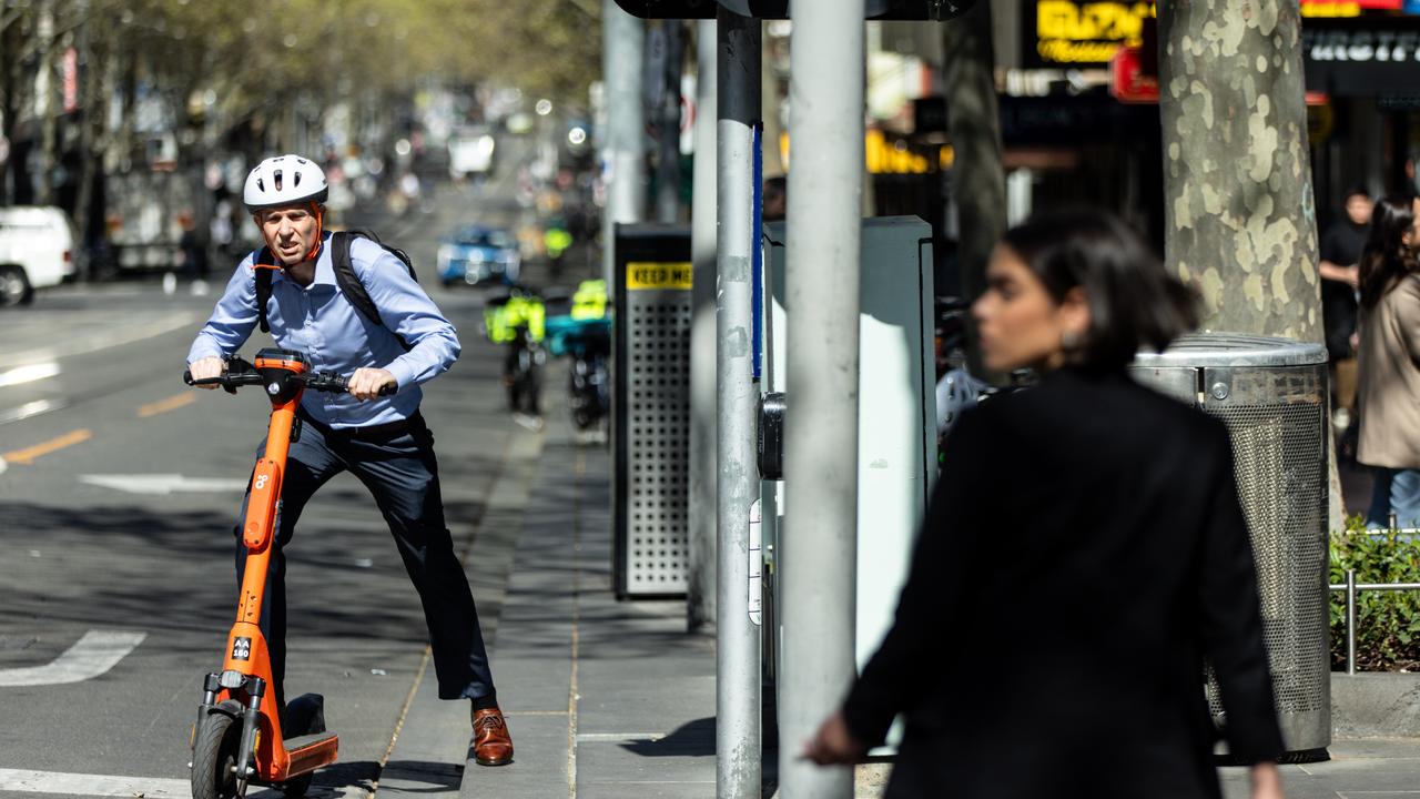 Office workers are seen in the Central Business District in Melbourne