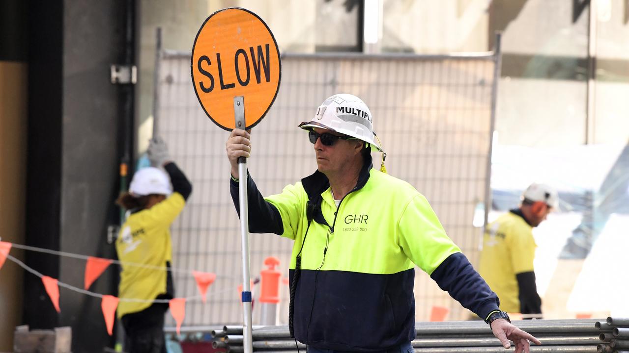 A worker holds a slow sign (file image)