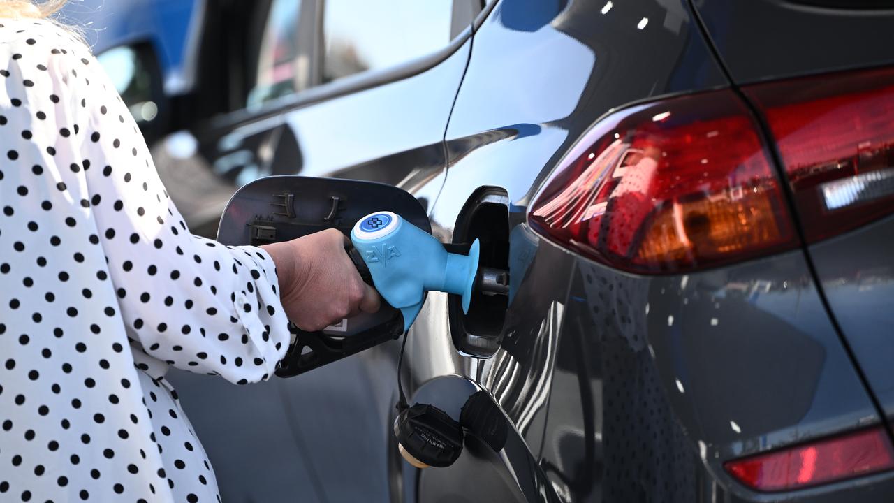 A motorists fills ups a car with fuel (file image)