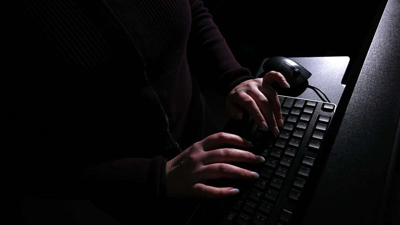 Hands placed on a keyboard