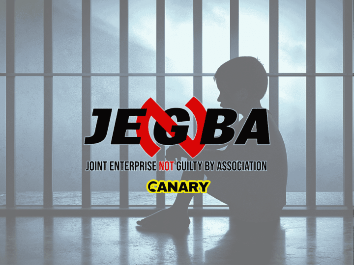 In the backgrounds is an image of a child in prison. It is the silhouette of a child facing left and they have their knees up to their chest. In the forefront is the JENGbA logo and underneath is the Canary UK logo