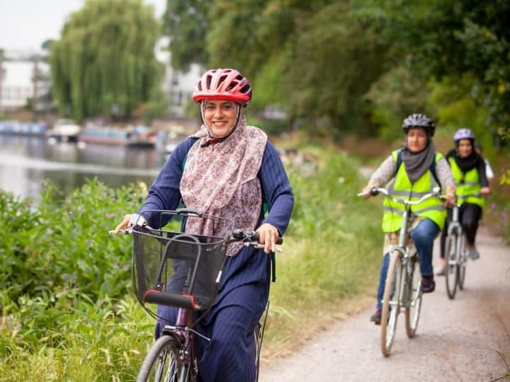 Women cycling along a towpath
