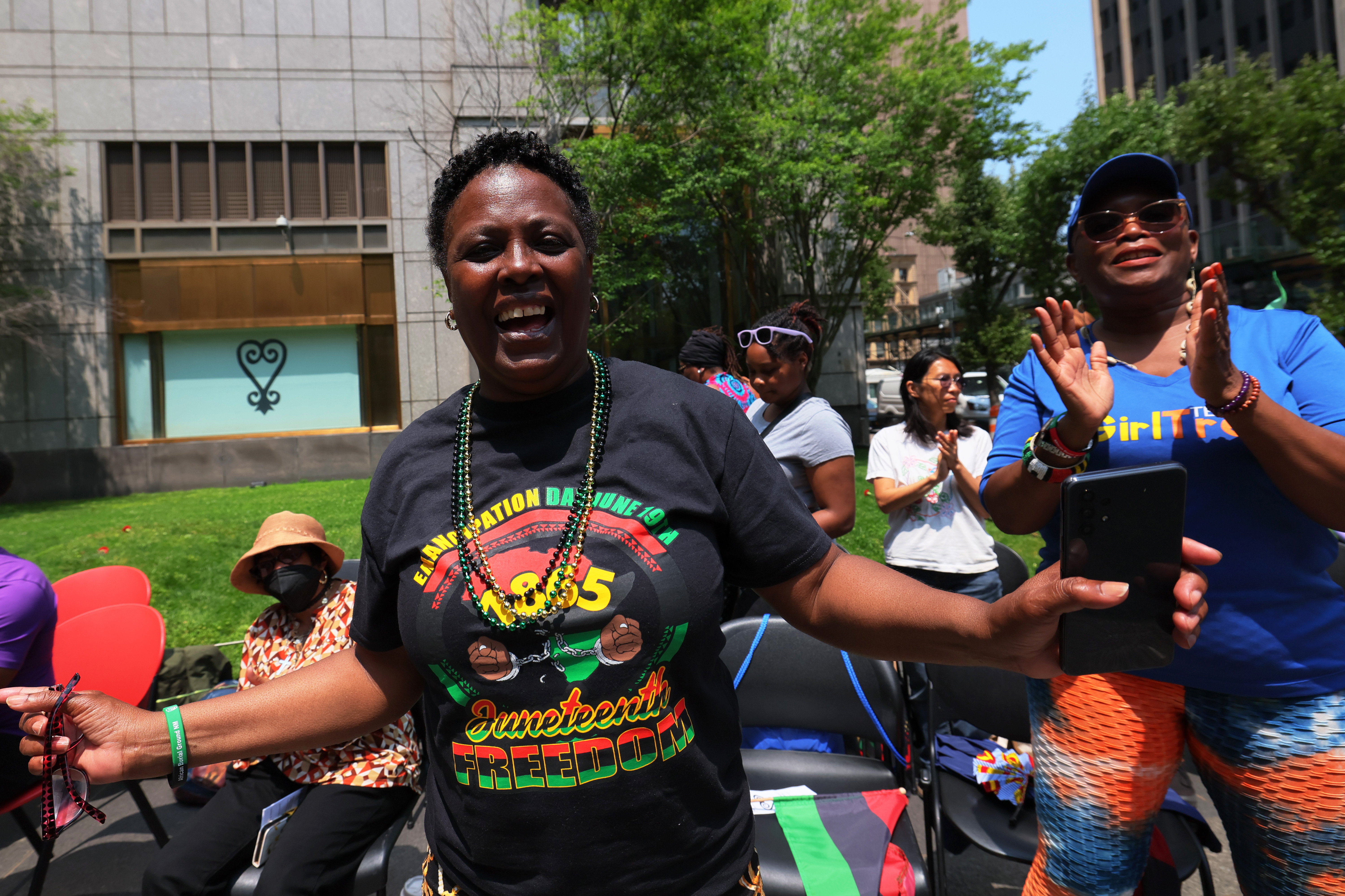 People celebrate Juneteenth at the African Burial Ground National Monument in 2023.