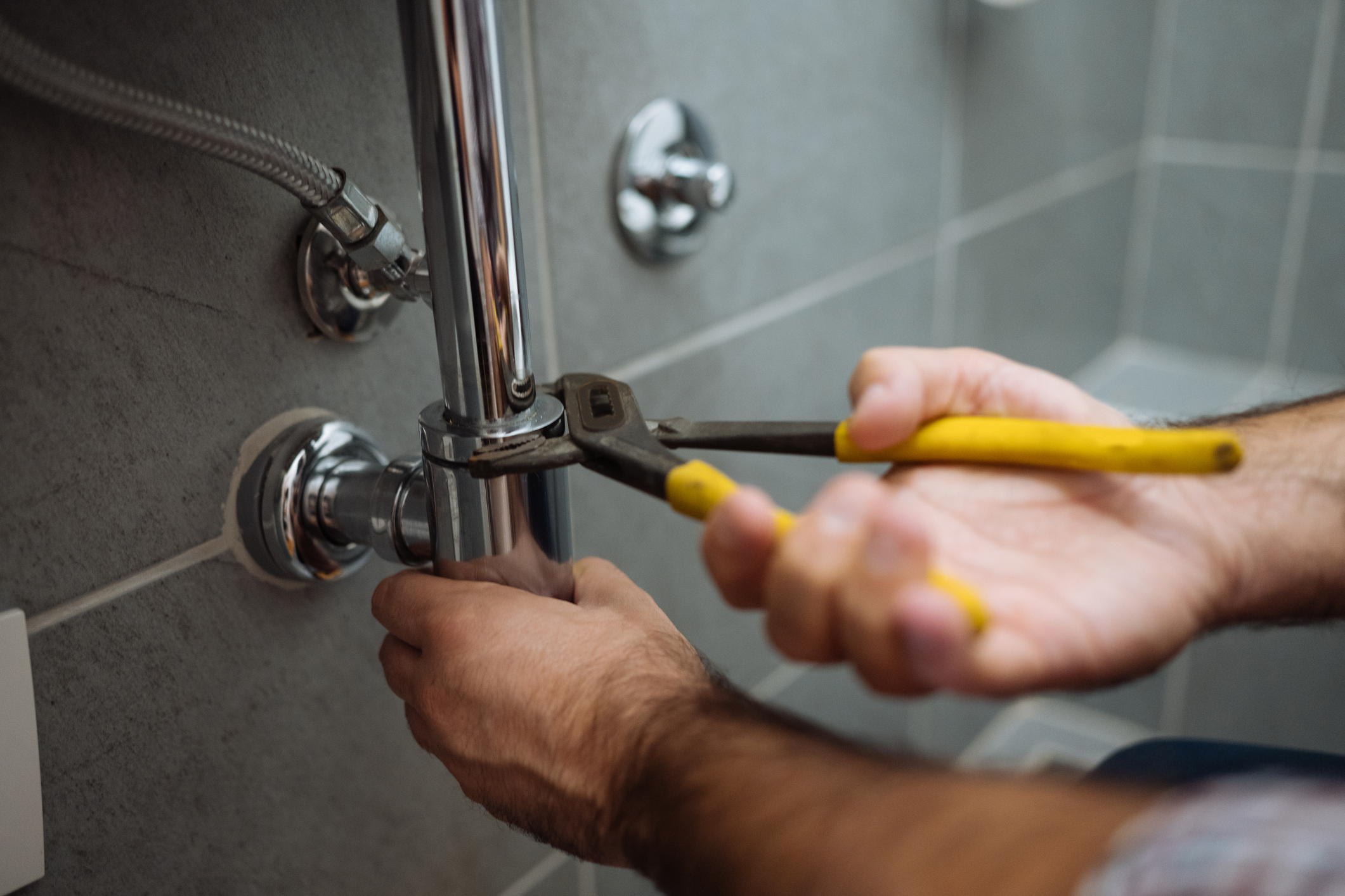 Stock photo of a plumber at work.