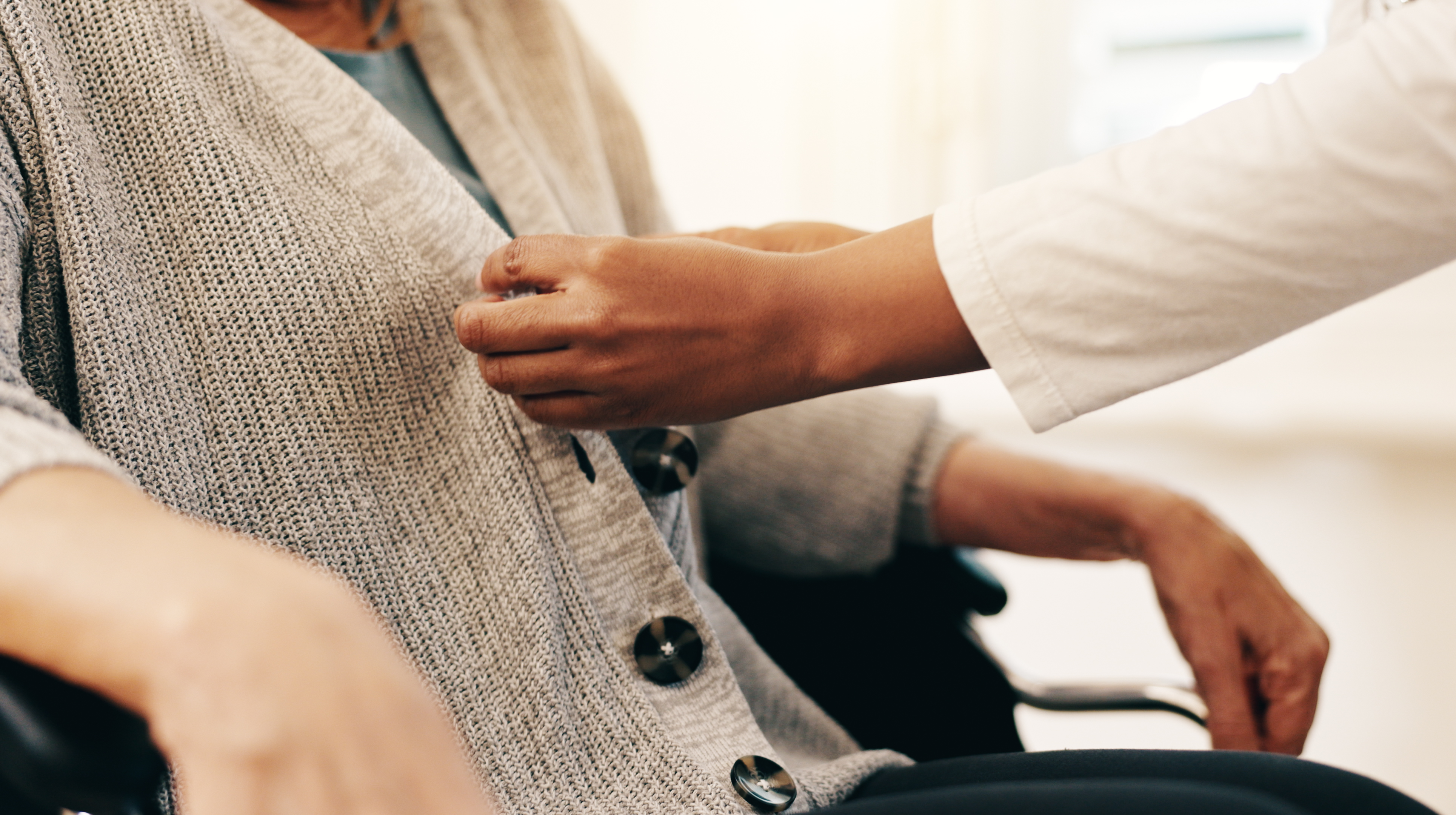 File photo of a healthcare worker tending to a patient.