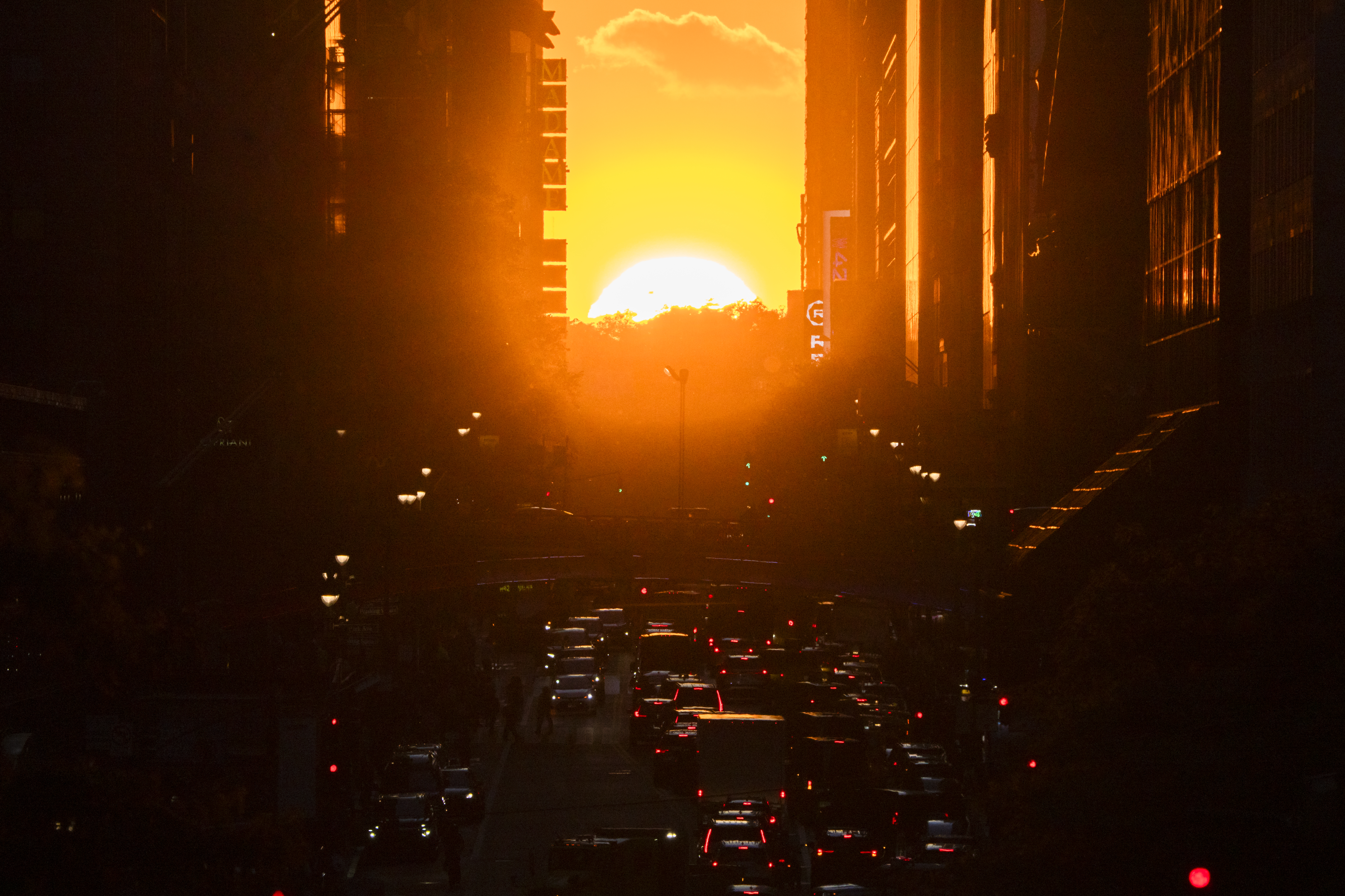 : New Yorkers gather on 42nd Street near Times Square to see the "Manhattanhenge" solar spectacle