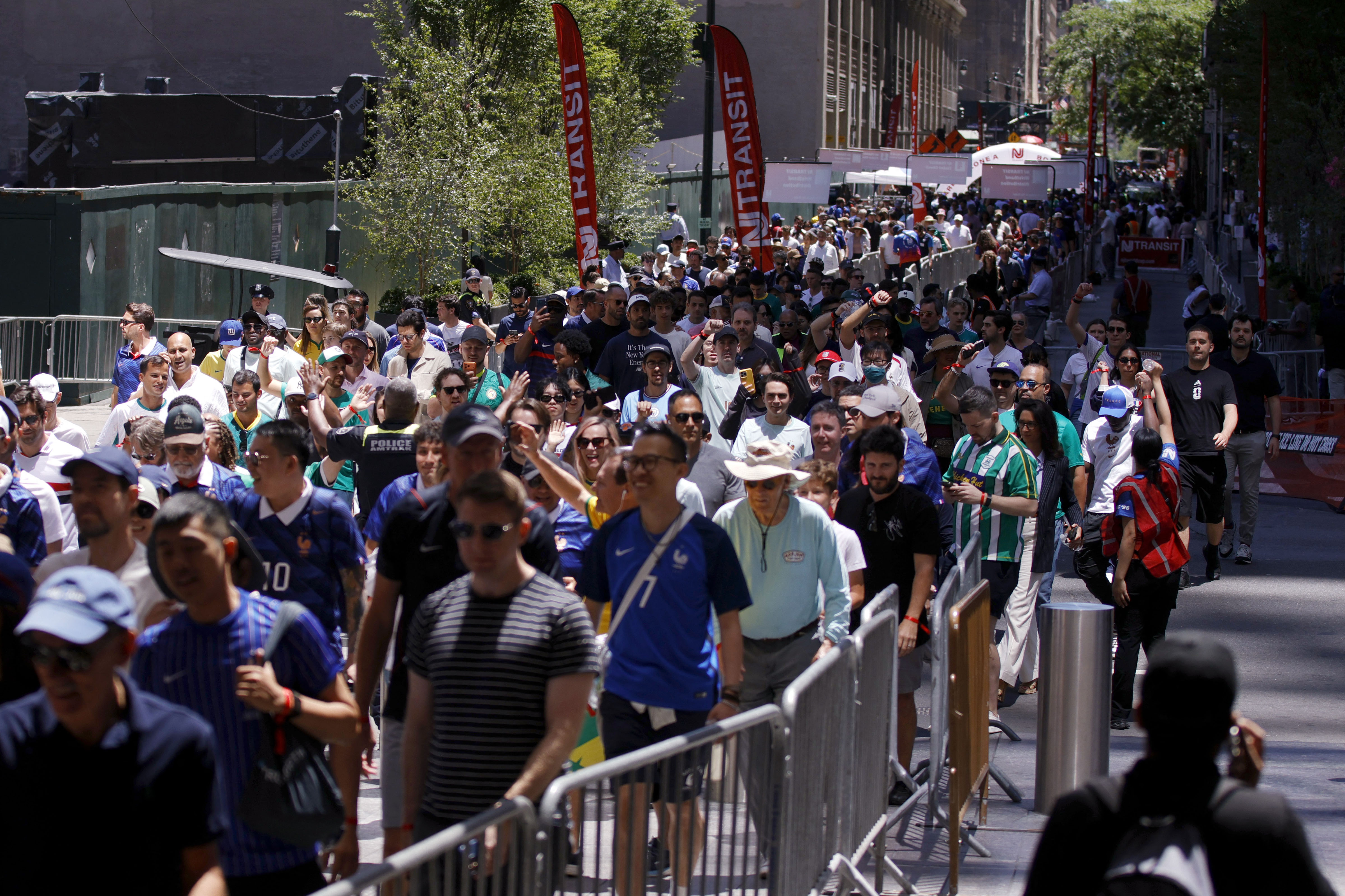 Fans from across the globe flooded into secure areas at Penn Station to get to the France-Senegal World Cup match on Tuesday.