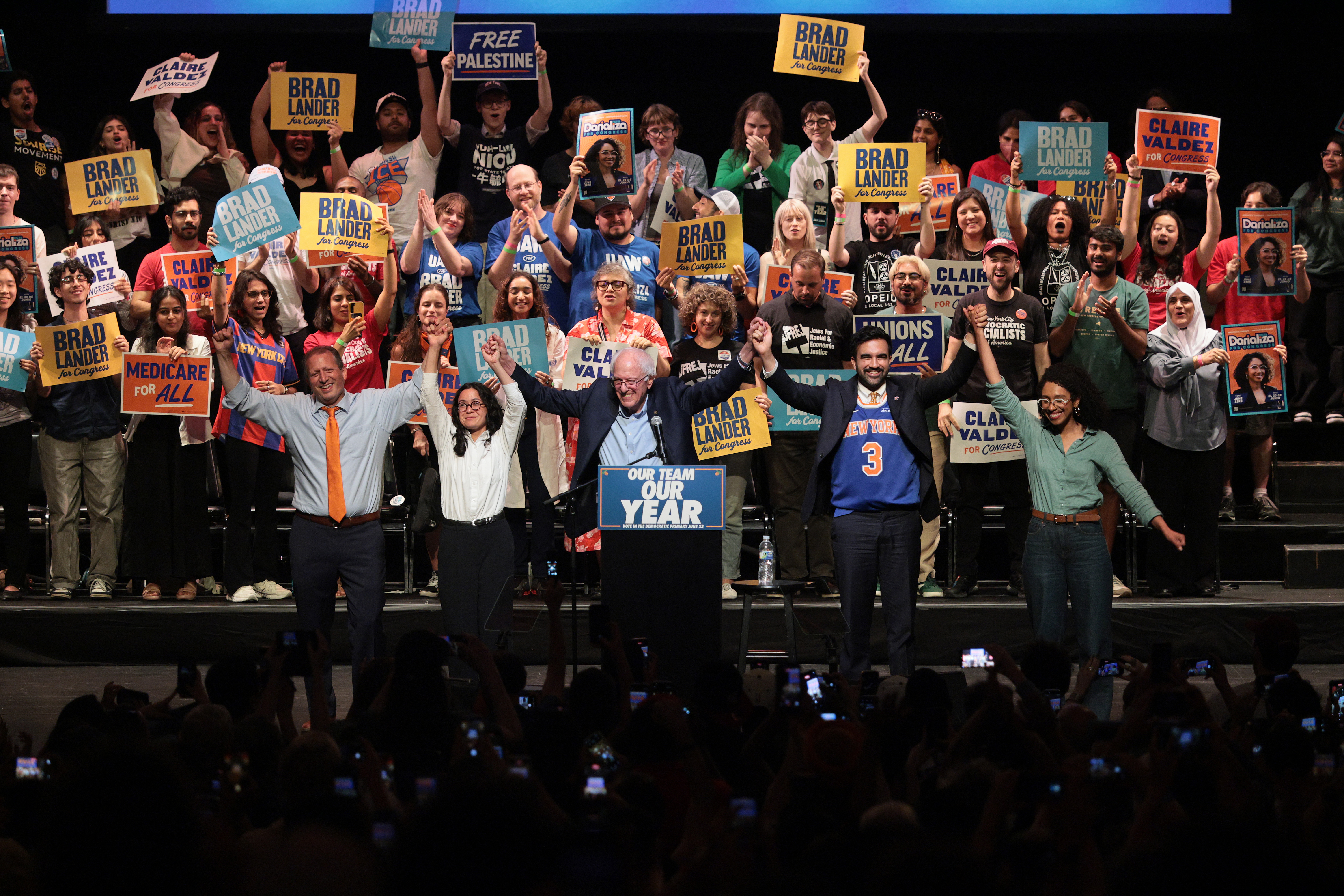 Bernie and his DSA allies celebrate in front of a big crowd.