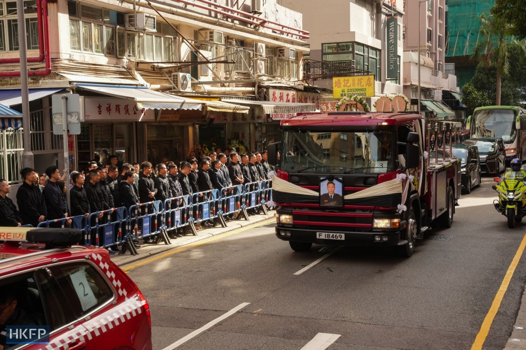 A fire engine converted into a hearse carrying the casket of firefighter Ho Wai-ho, who died in the Wang Fuk Court fire, on December 19, 2025. Photo: Kyle Lam/HKFP.