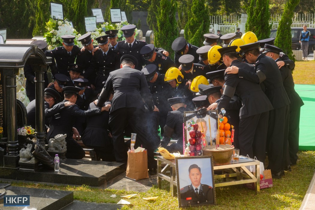 Firefighters bury Ho Wai-ho, who died in the Wang Fuk Court fire, at Gallant Garden on December 19, 2025. Photo: Kyle Lam/HKFP.