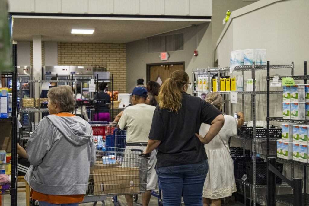 People shop the shelves at the Ritenour Co-Care Food Pantry just outside of St. Louis last week. The nonprofit has seen rising need as grocery prices soar and thousands of Missourians lose federal food assistance. (Photo courtesy of Ritenour Co-Care Food Pantry)