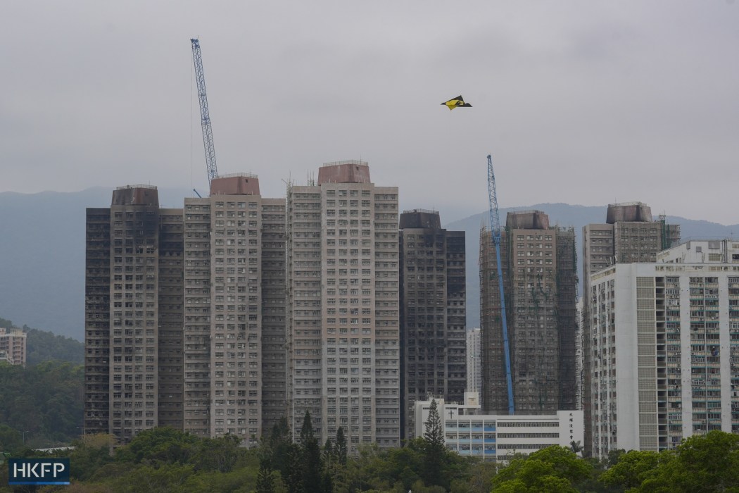 A paper kite flies over Wang Fuk Court on January 30, 2026. Photo: Kyle Lam/HKFP.