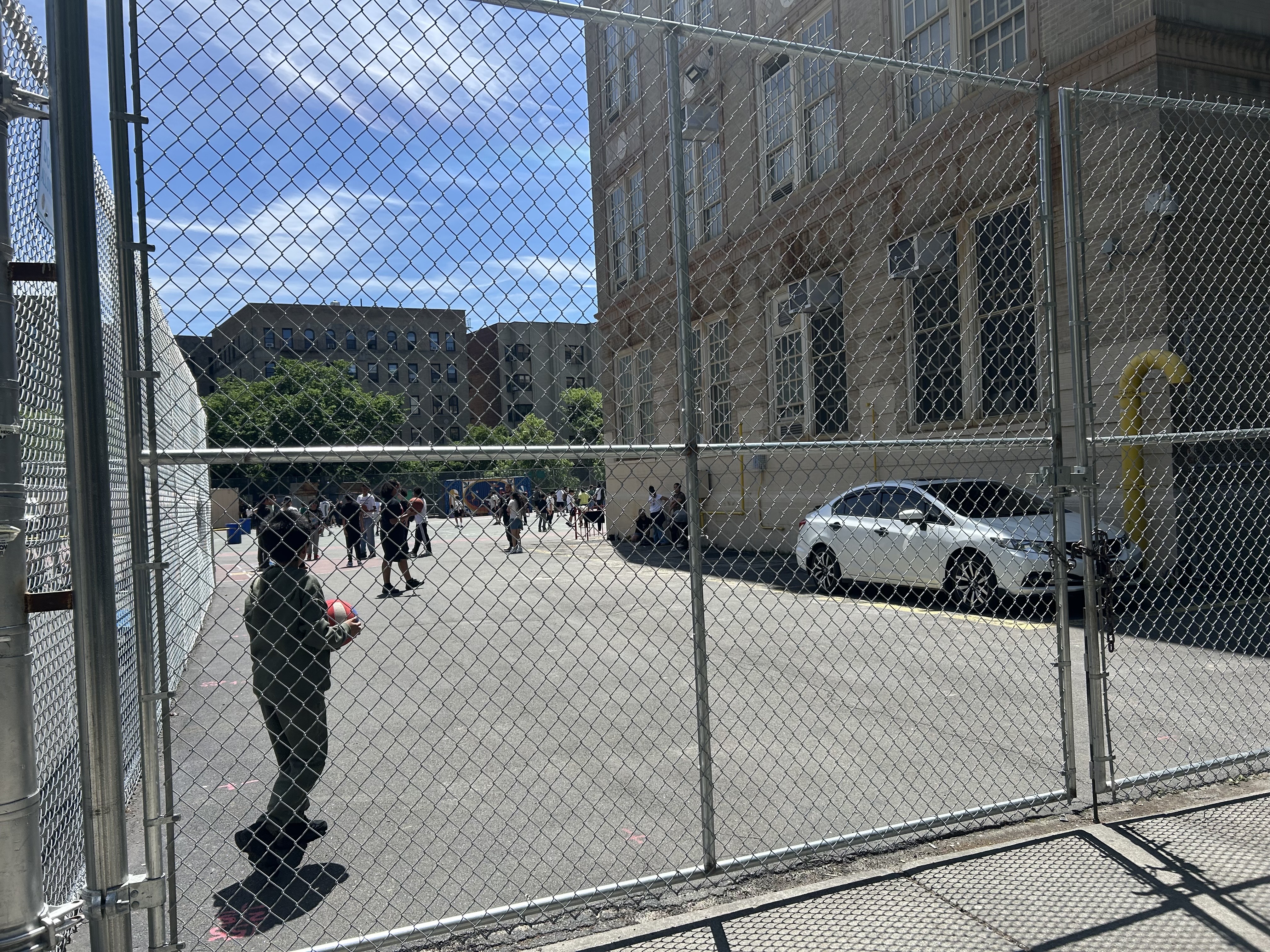 Students playing on a blacktop.