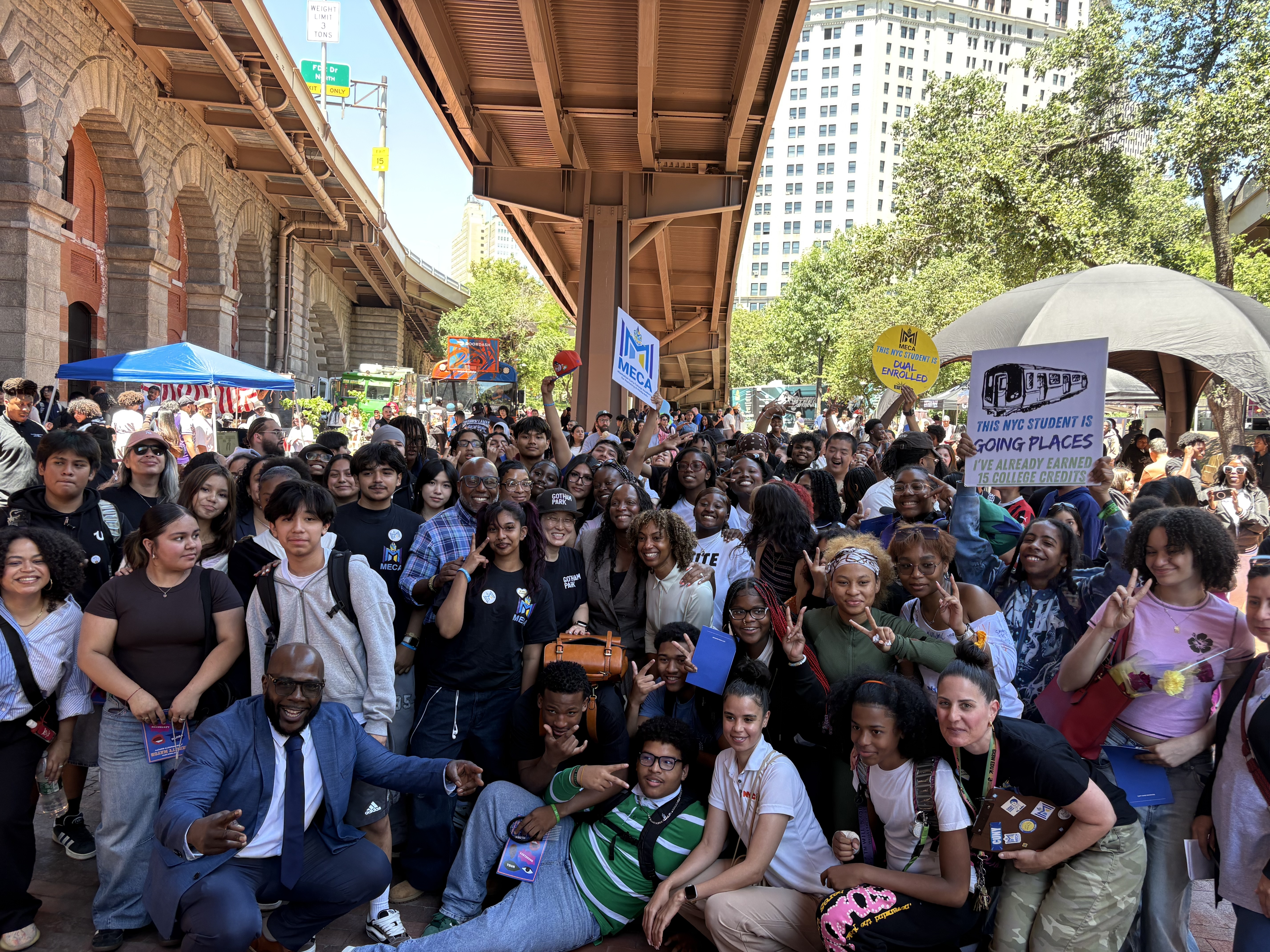 Deputy Mayor for Public Safety poses with students and teachers from MECA High School at a year-end celebration in lower Manhattan