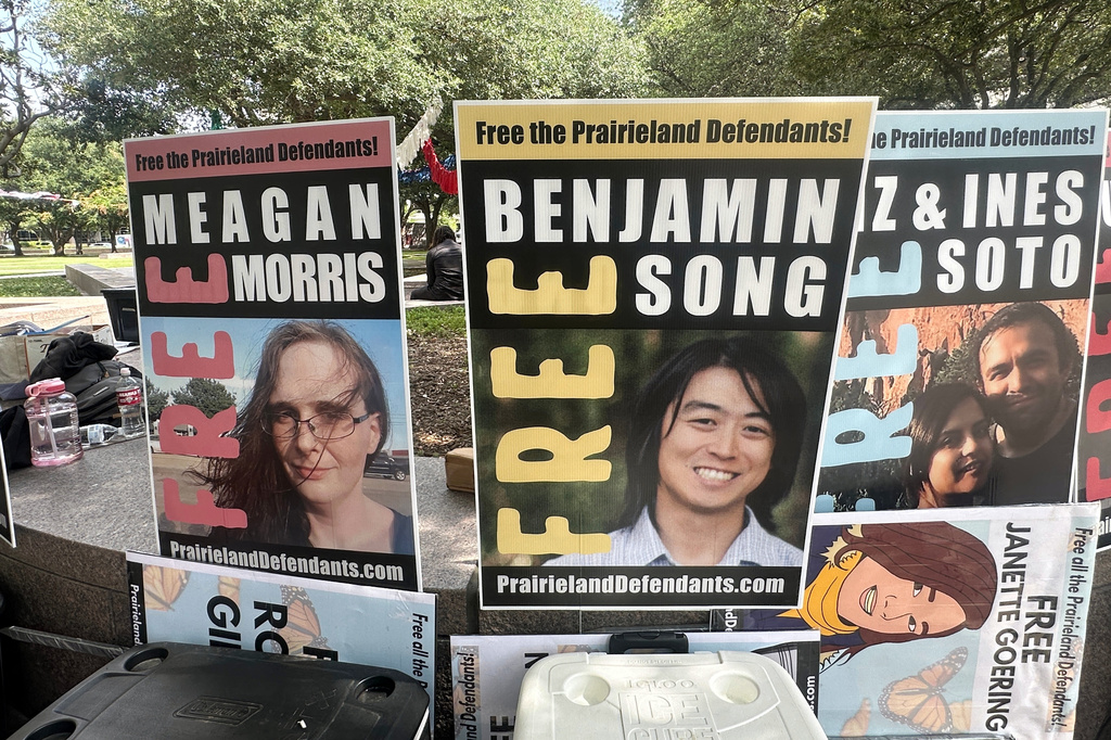 violent ICE protest - signs show some of defendants in Texas protest