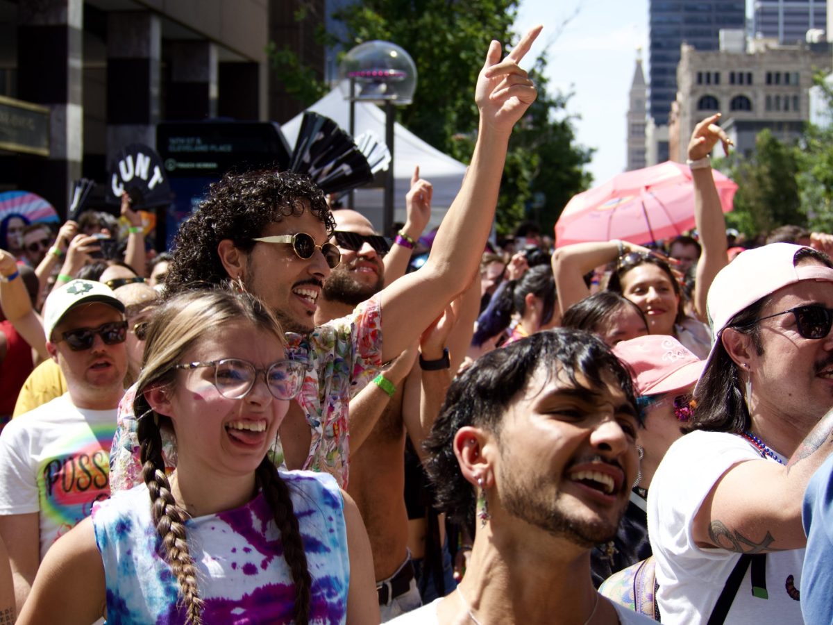 People cheering for a performance at Denver PrideFest