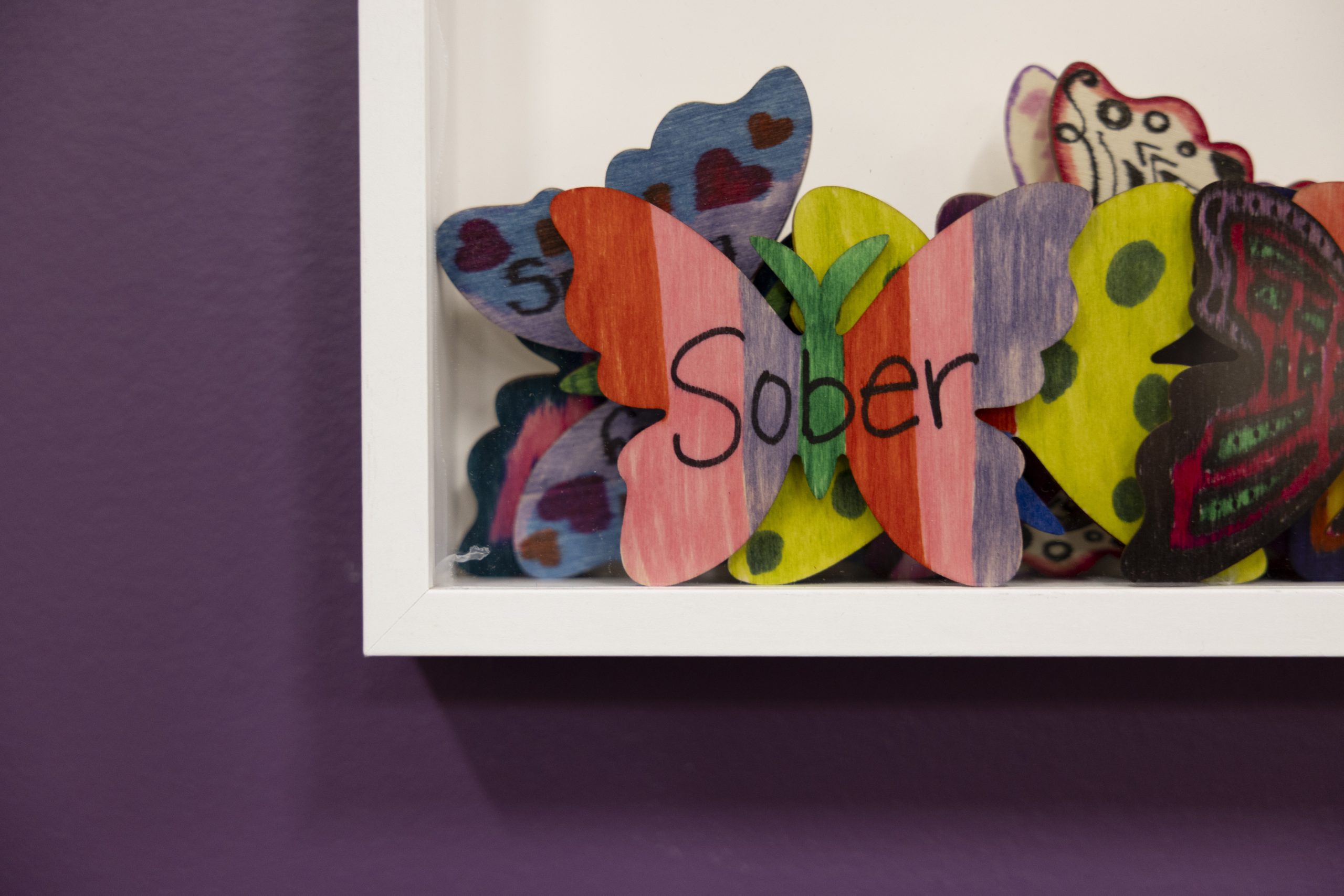 a close up of handwritten artwork on a butterfly
