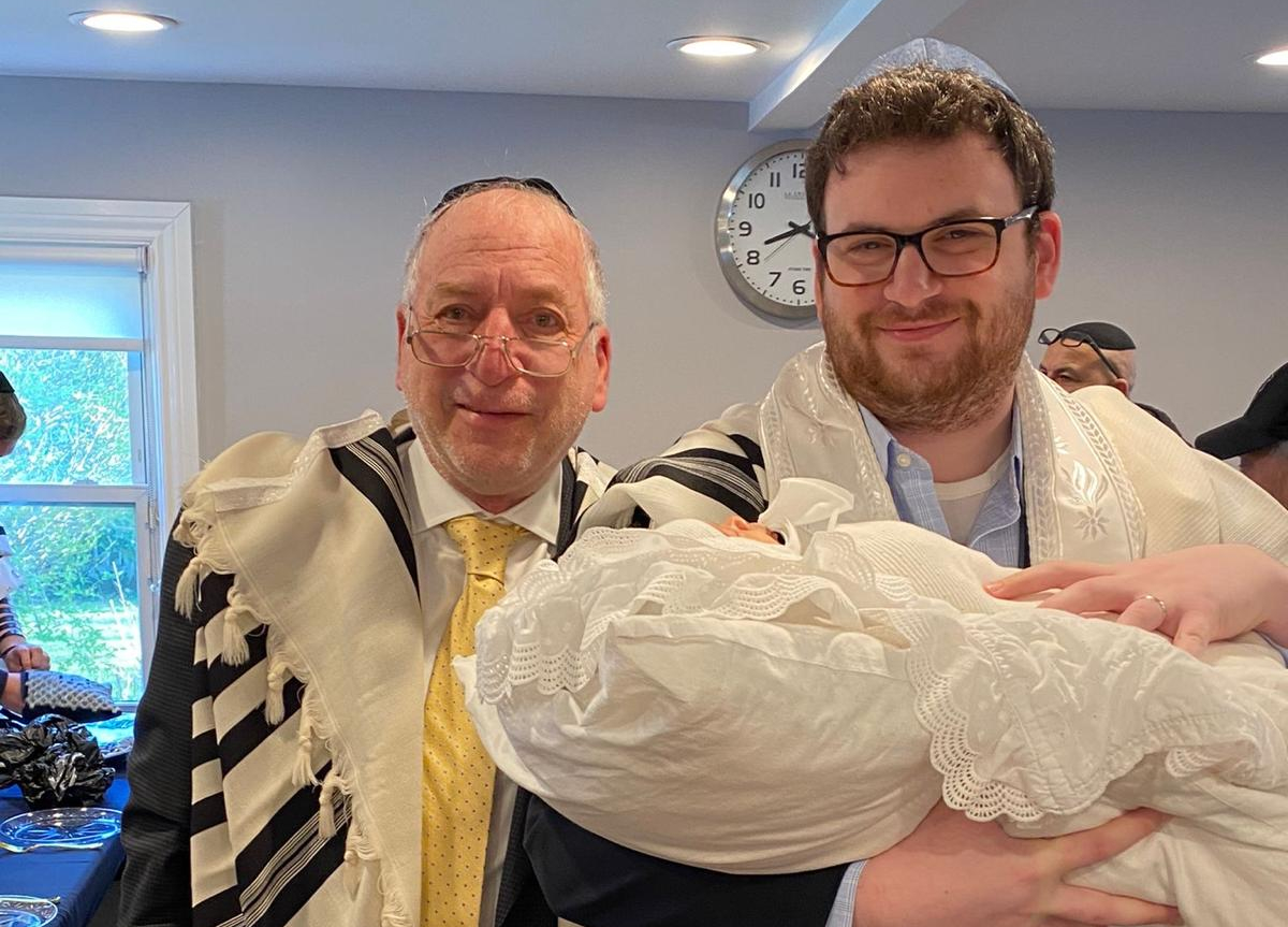 Albert "Avrumie" Itzkowitz, left, poses with his son, Tzvi Yonie Itzkowitz, at a family celebration in an undated family photo.