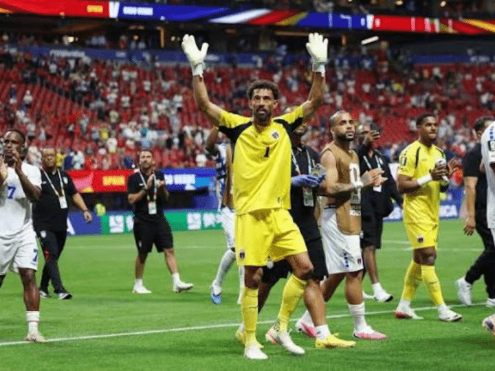 Vozinha, Cape Verde goalkeeper greets the crowd from the middle of the pitch with his hands up