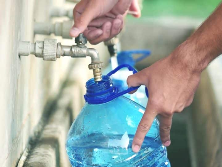 Running water Bottle filling up from tap