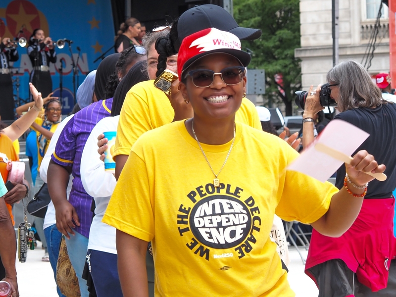 Te'Drenna Coleman, 27, of Charlotte, North Carolina, danced at the Next250 rally in Washington, D.C., on Saturday, June 27, 2026, as the Maryland-based Mariachi Imperio band played. (Photo by Ashley Murray/States Newsroom)