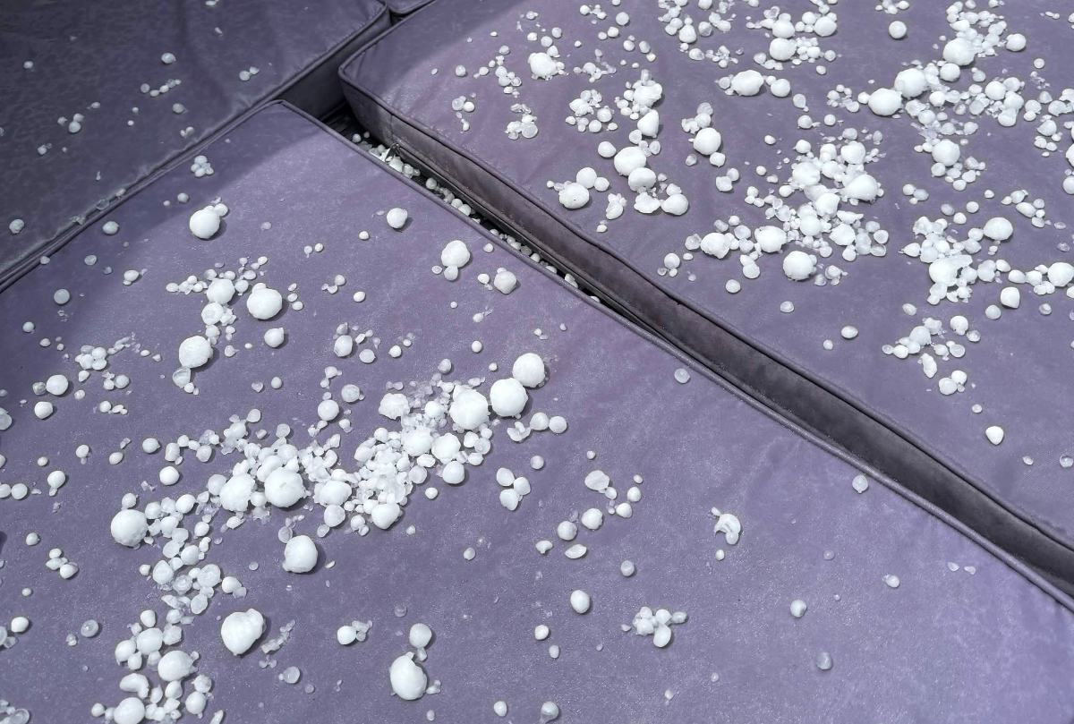 Hail hits a chair in a Colorado backyard