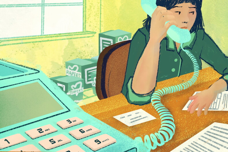 An illustration of a medium-light skin tone woman sitting at a desk with diapers and boxes in the background on a corded phone with papers in front of her. 