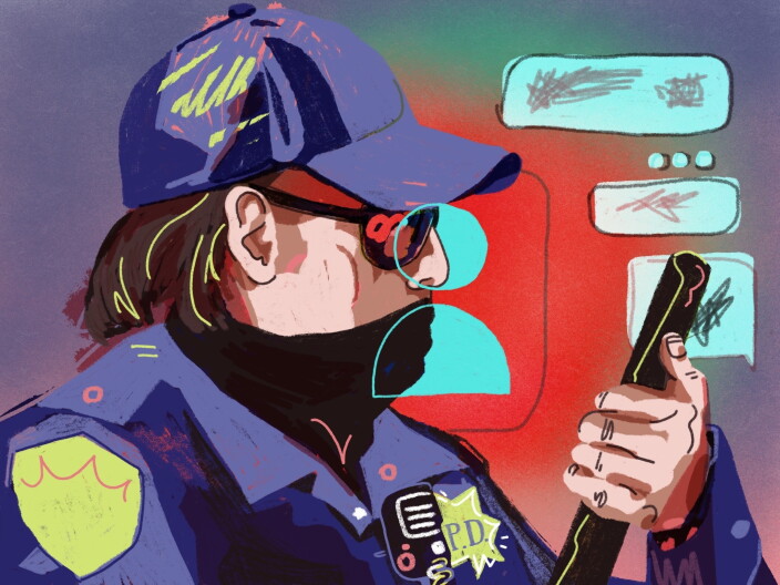 A law enforcement officer scrolls through messages on a mobile phone.
