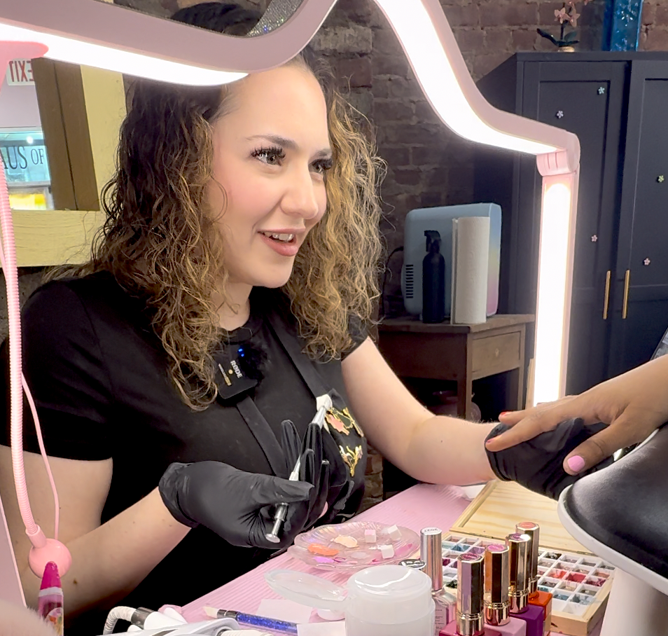 Haus of Femme owner Samantha Diz doing Giulia Heyward's nails for Pride.