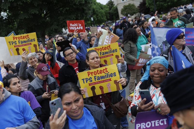 Demonstrators chant and hold signs outside U.S. Supreme Court on April 29, 2026 in Washington, DC. The court heard arguments challenging DHS's termination of Temporary Protected Status for asylum seekers. (Photo by Tom Brenner/Getty Images)