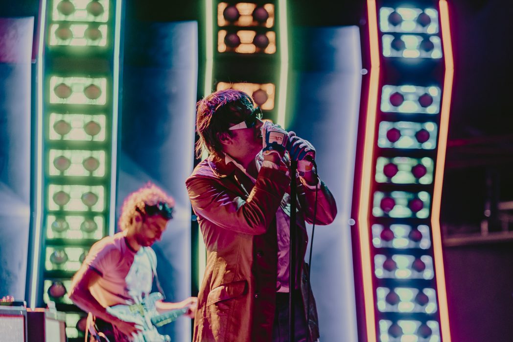 A photo of The Strokes performing live at Red Rocks on July 22.