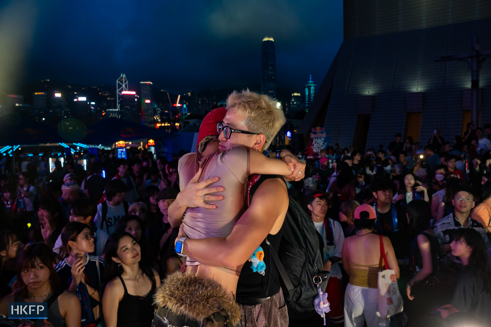 Audiences hug each other after the Red Bull Dance Your Style competition in Tsim Sha Tsui, July 19th, 2026. Photo: Kyle Lam/HKFP.