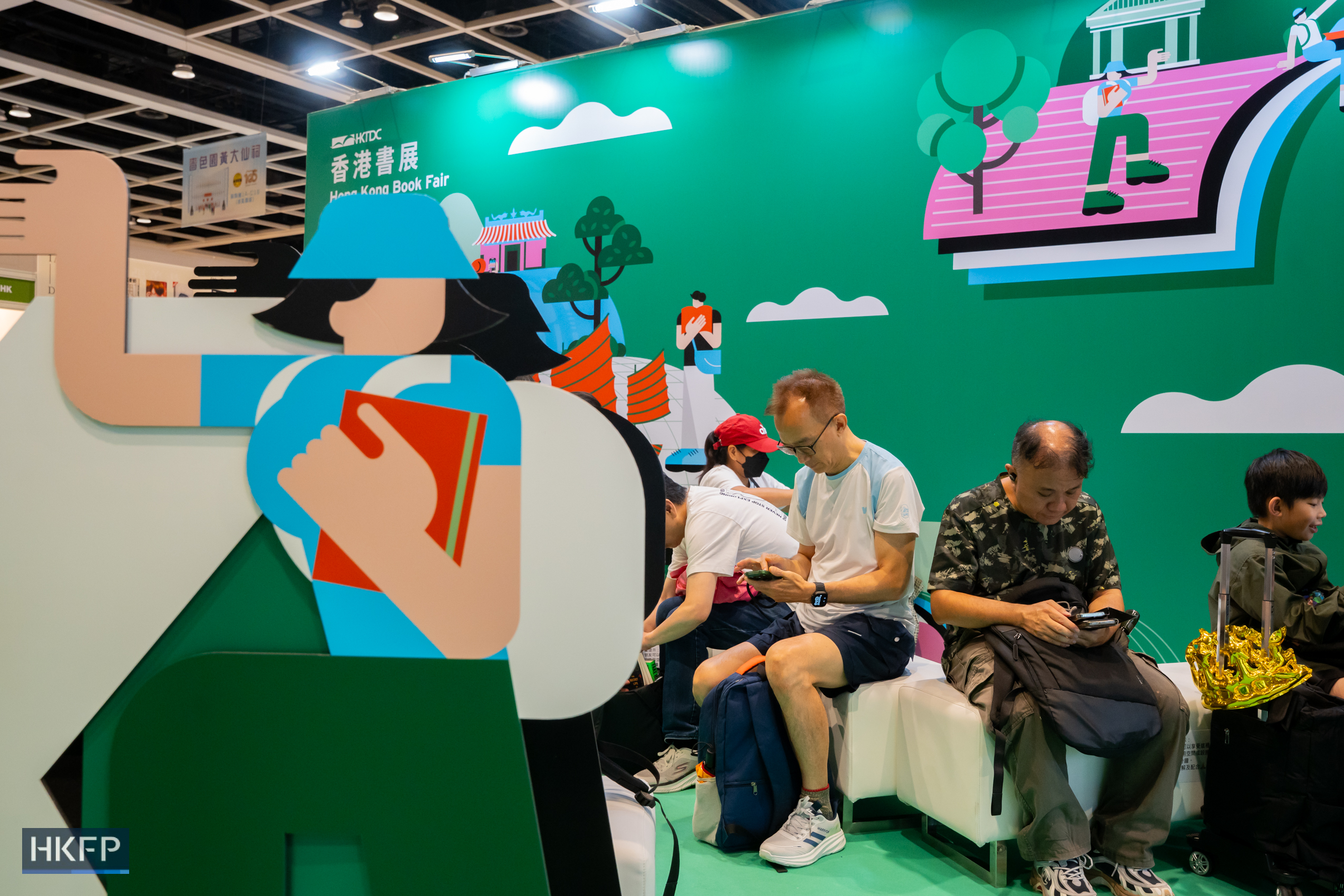People attend the Hong Kong Book Fair in Hong Kong Convention and Exhibition Centre in Wan Chai, on July 17th, 2026. The locations where booths of independent booksellers once stood have been turned into reading areas this year. Photo: Kyle Lam/HKFP.