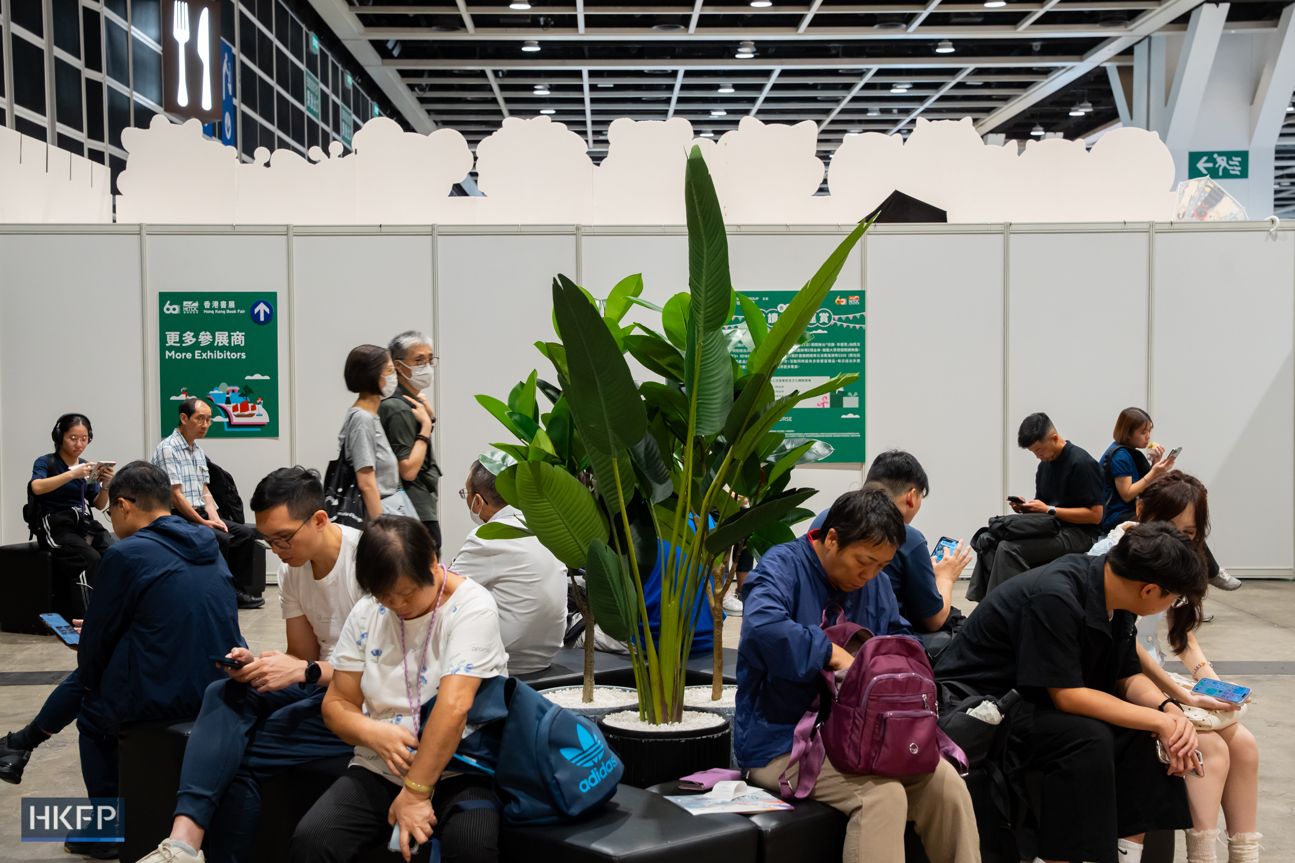 People attend the Hong Kong Book Fair in Hong Kong Convention and Exhibition Centre in Wan Chai, on July 17th, 2026. The locations where booths of independent booksellers once stood have been turned into reading areas this year. Photo: Kyle Lam/HKFP.