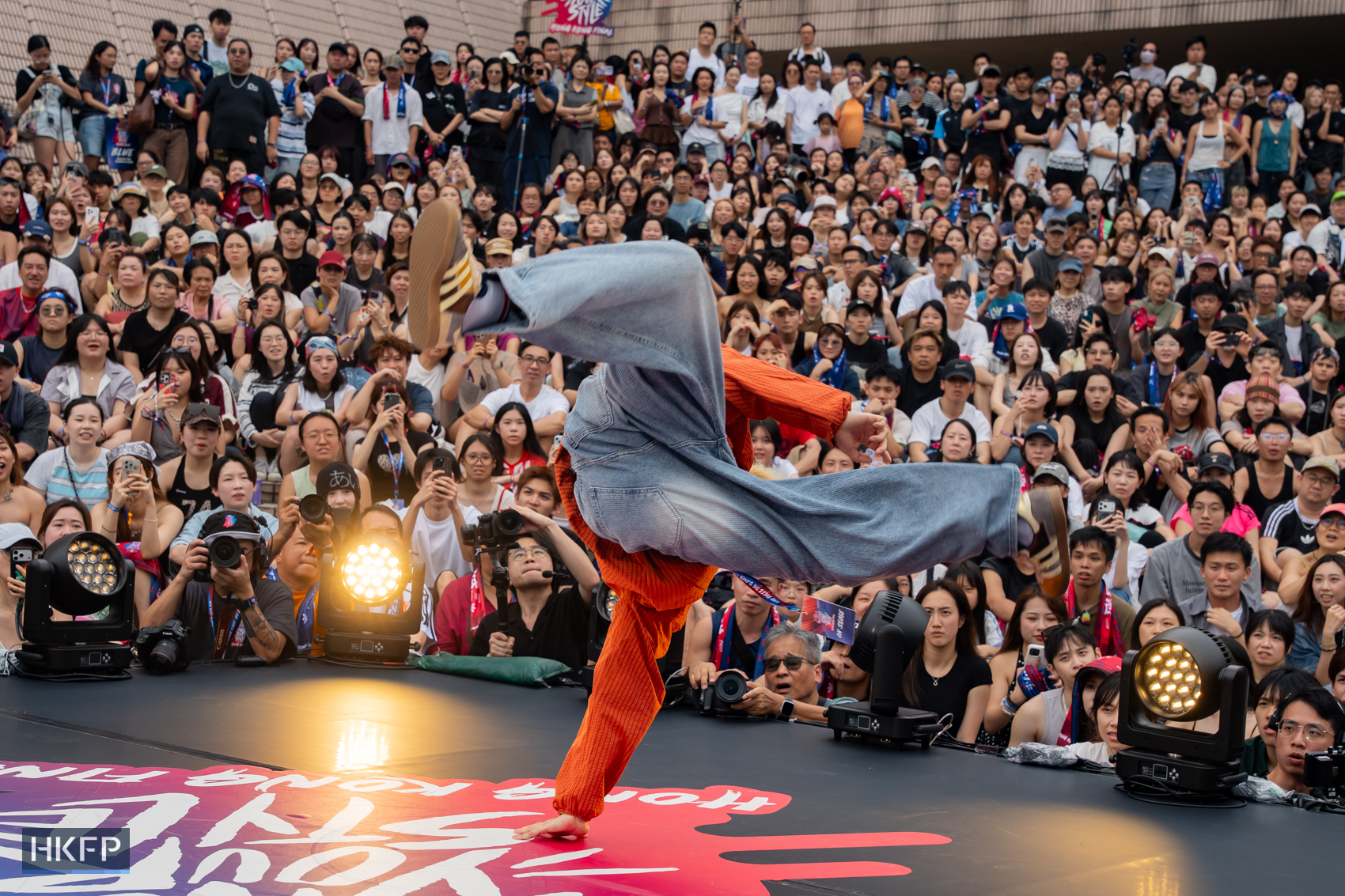 Chak performs on stage during Red Bull Dance Your Style competition in Tsim Sha Tsui, July 19th, 2026. Photo: Kyle Lam/HKFP.