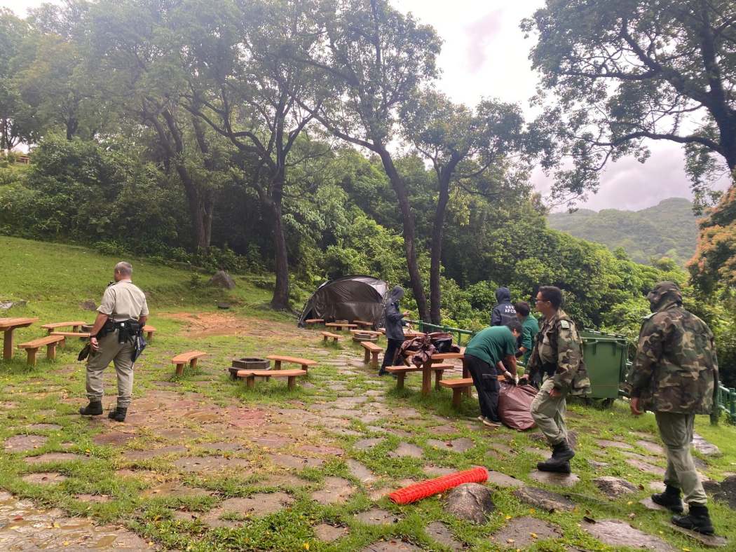 Agriculture, Fisheries and Conservation Department (AFCD) personnel clear tents and other belongings from the Tai Tan Campsite in Sai Kung West Country Park in July 2026. Photo: Agriculture, Fisheries and Conservation Department, via Facebook.
