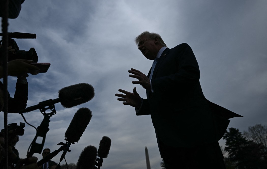 US President Donald Trump speaks to journalists before boarding Marine One as he departs from the South Lawn of the White House in Washington, DC, on March 20, 2026 for his Mar-a-Lago residence, where he will spend the weekend. Photo: Brendan Smialowski/AFP.