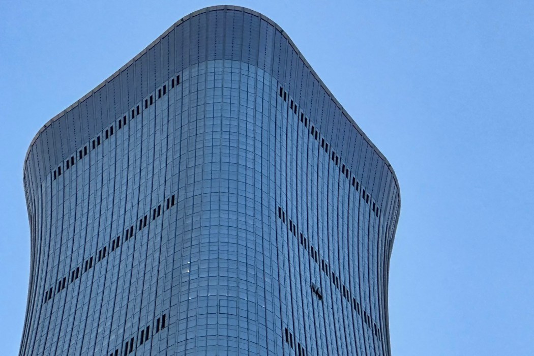 A hole is seen on the side of the CITIC Tower in Beijing on June 26, 2026, after an eyewitness reported plane debris at the base of Beijing's tallest building. Photo: Peter Cattereall/ AFP.
