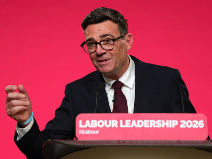 Andy Burnham on a podium speaking for the first time as the UK's Labour leader