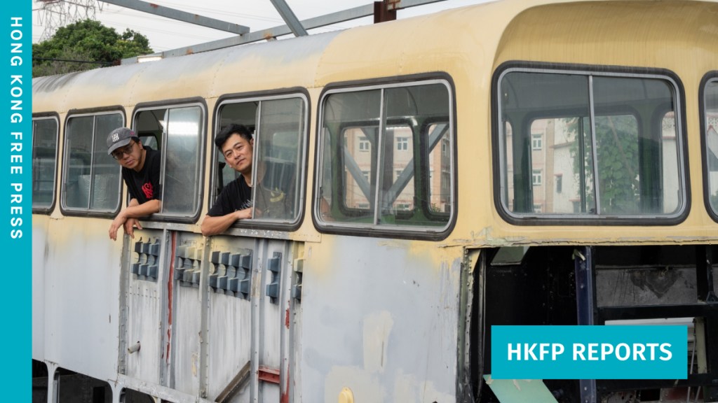 Chung (left) and Terrence with their Leyland Victory Mark II bus, which is undergoing restoration. Photo: Kyle Lam/HKFP.