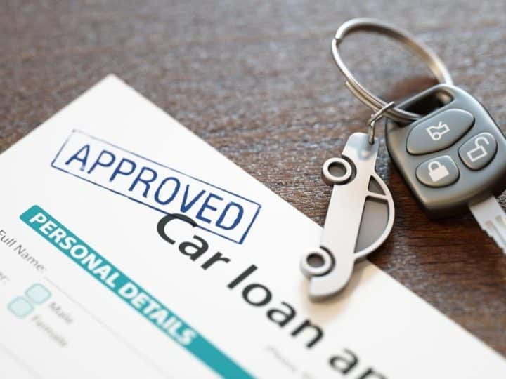 Image of car loan agreement and car key Economic abuse using car finance
