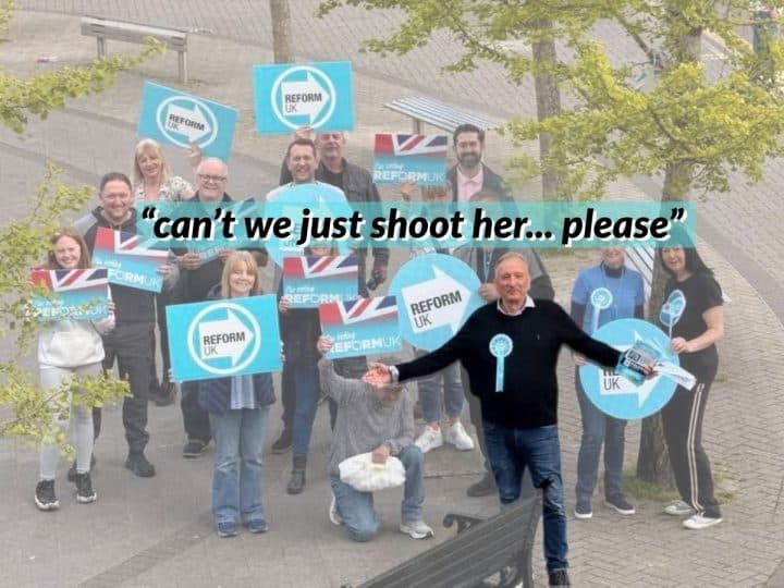 Reform UK politician Adrian White with others holding Reform logo posters behind him