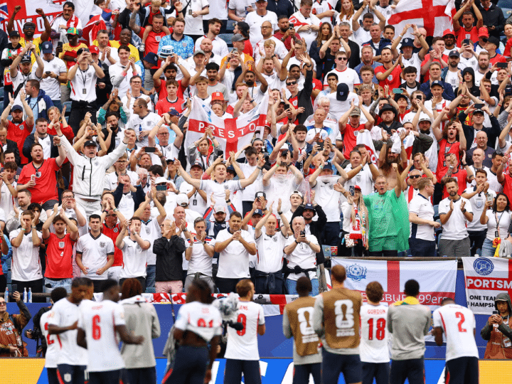 England v Ghana at the Boston Stadium, on 23 June 2026. England fans applaud the players after the match from the fans. It's a vivid array of flags, England shirts and red and white