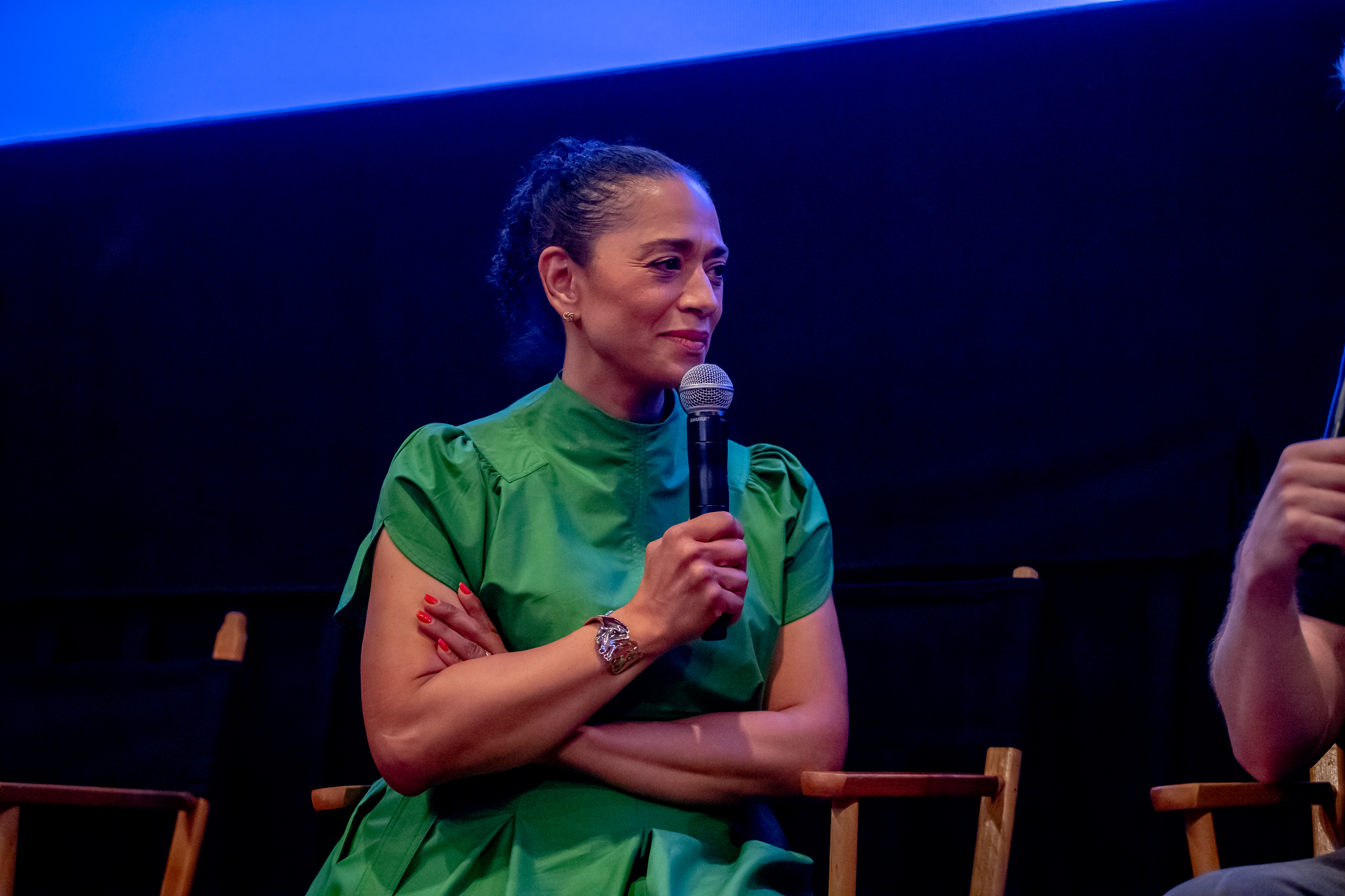 A woman holding a mic.