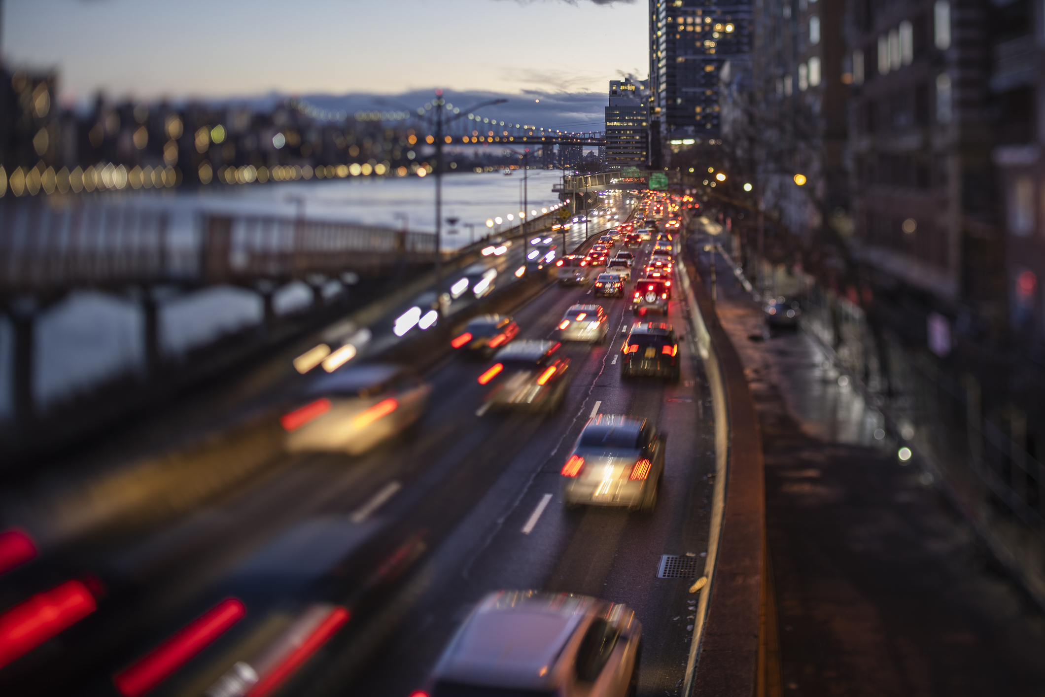 A view of the Upper East Side of Manhattan, along the FDR Drive at night.