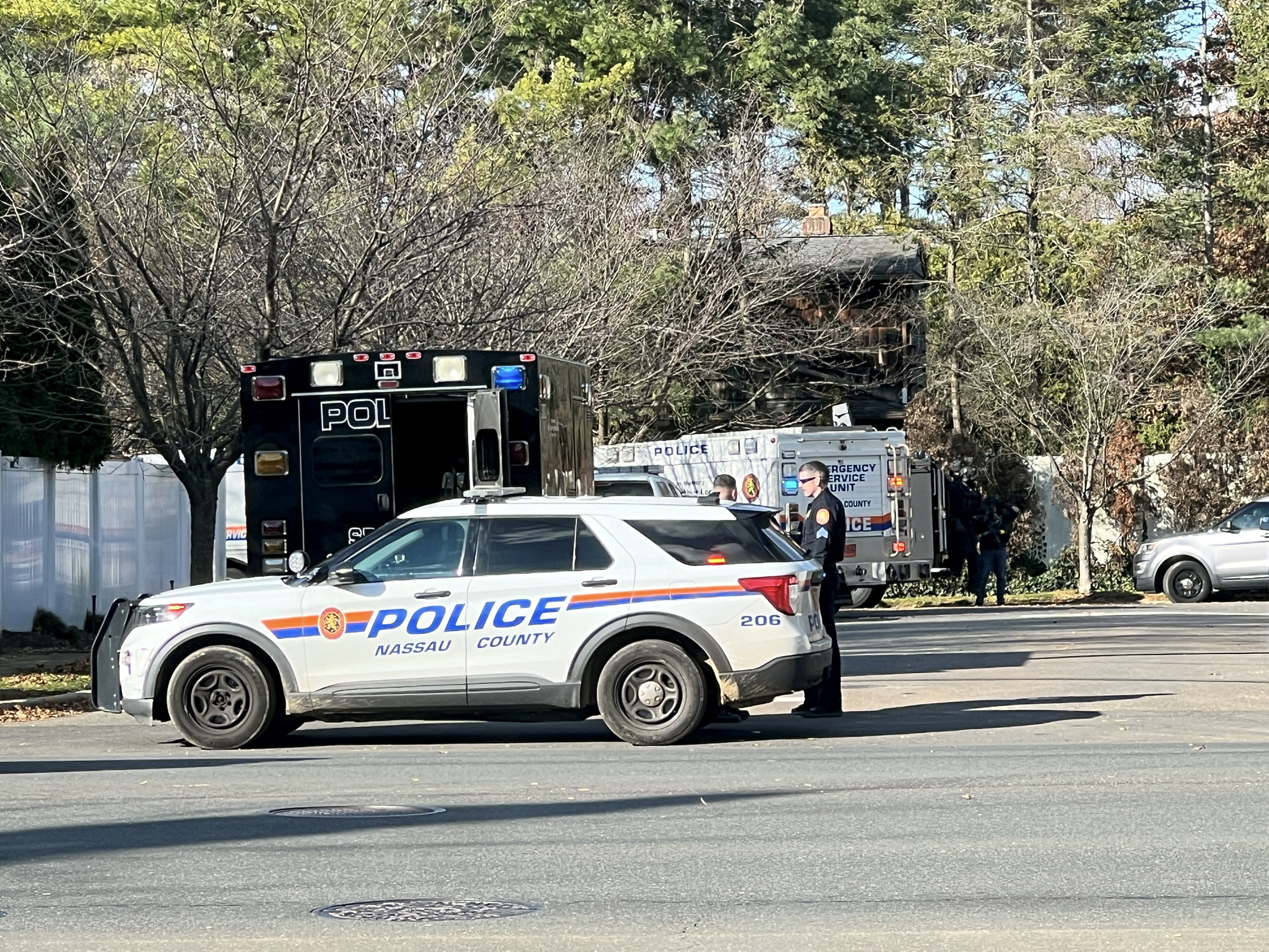 Nassau County police respond to a man who barricaded himself for hours in a house located off Woodbury Road in Woodbury, New York, on November 28, 2023.