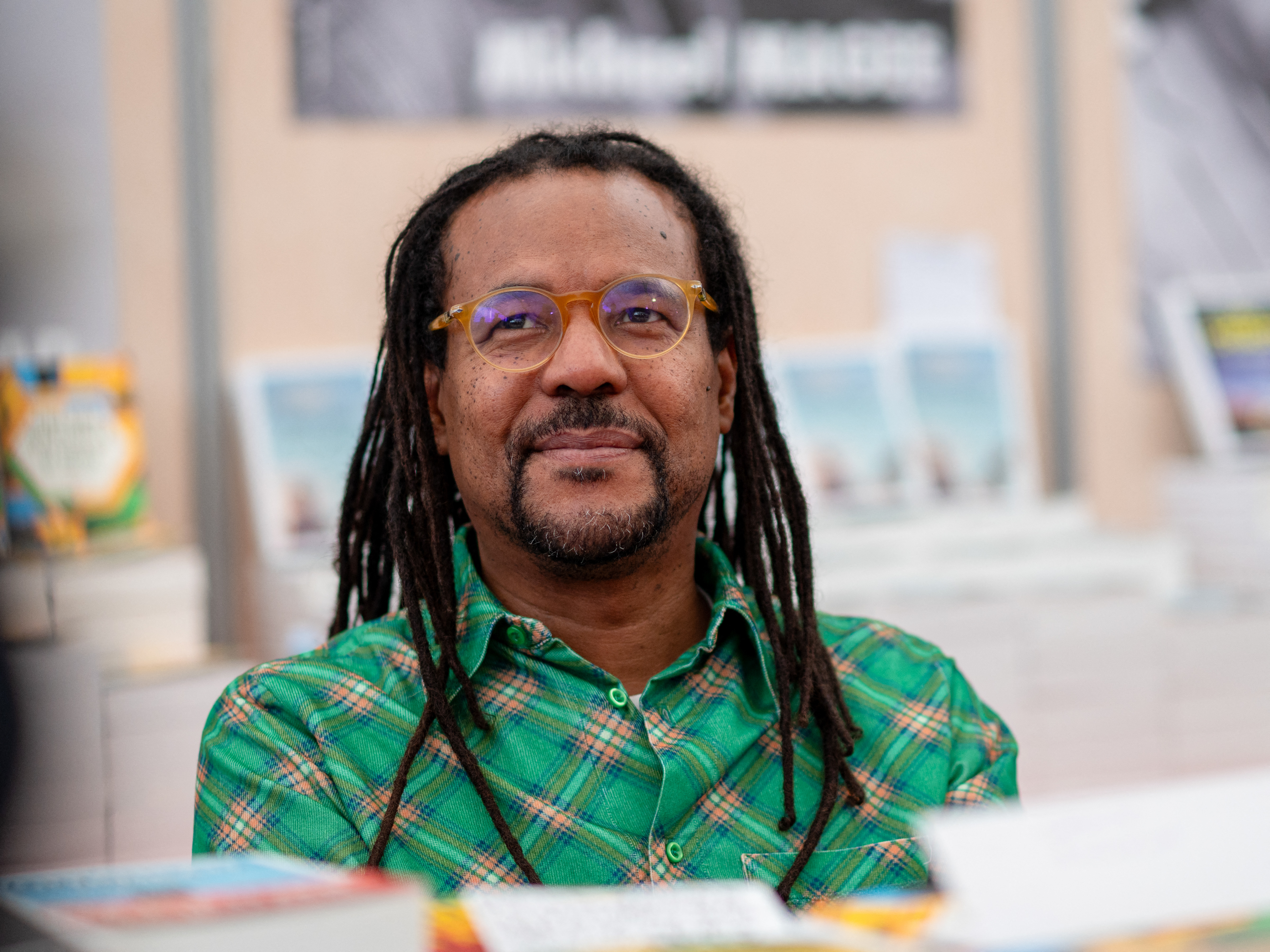 The author Colson Whitehead in a green shirt