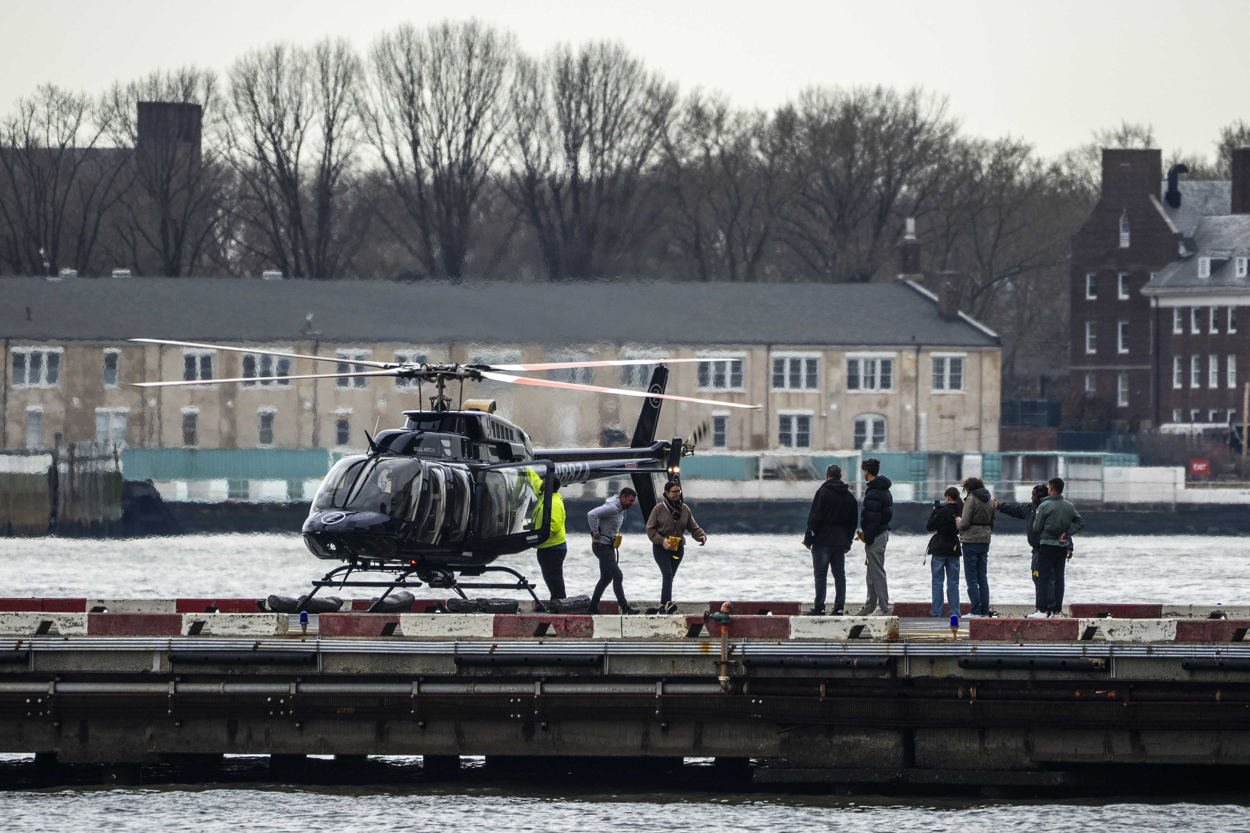 Tourists board a helicopter.